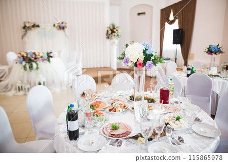 Interior of a restaurant prepared for wedding ceremony Interior of a restaurant prepared for wedding ceremony 115865978