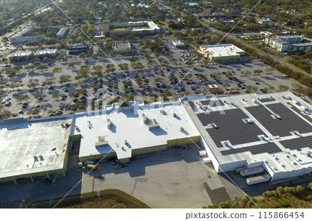 Aerial view of many cars parked on parking lot in front of a grocery mall store 115866454