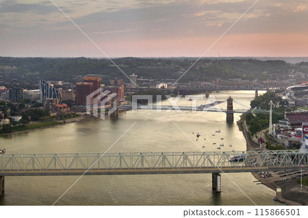 Covington, Kentucky USA. Skyline with bridge traffic and brightly illuminated high skyscraper buildings in modern American city 115866501