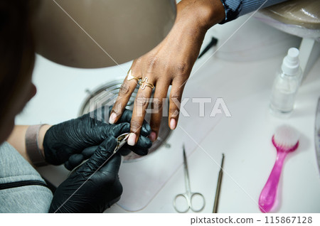 Professional manicure session in a modern beauty salon 115867128