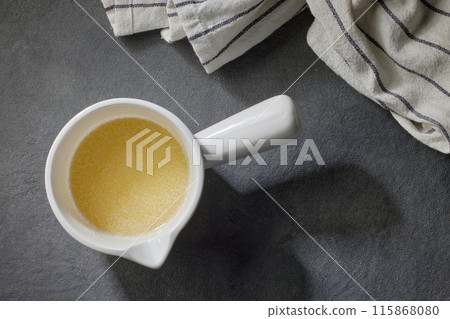 bowl of melted butter bowl of melted butter 115868080