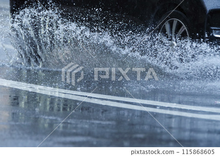 A car splashing water 115868605