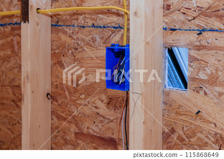 Installing mounting wiring in wall electric box for socket in new house Installing mounting wiring in wall electric box for socket in new house 115868649