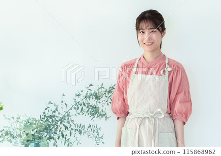 Portrait of a woman growing houseplants Portrait of a woman growing houseplants 115868962