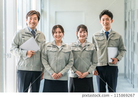 Male and female staff in the manufacturing, building, transportation, and construction industries wearing work clothes. Male and female staff in the manufacturing, building, transportation, and construction industries wearing work clothes. 115869267