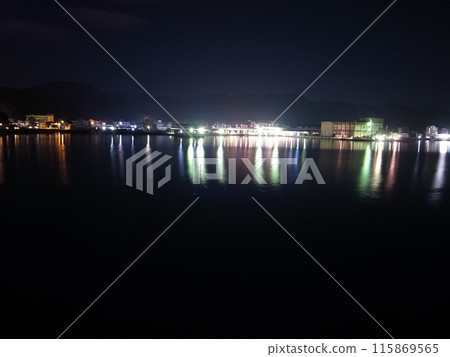 A fishing boat floating in the sea 115869565
