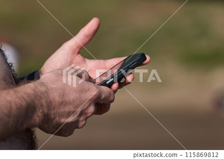 Smartphone at the beach 115869812