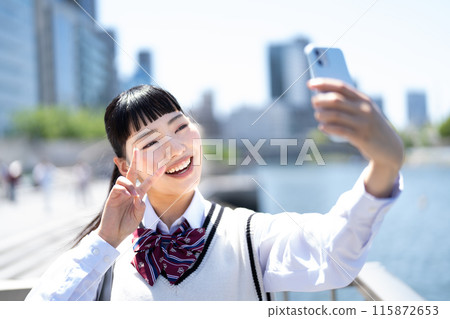 High school girl taking a selfie High school girl taking a selfie 115872653