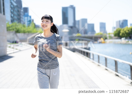 A woman who jogs A woman who jogs 115872687