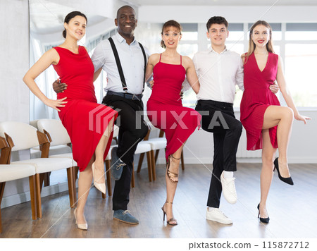 Group of women and men performing sirtaki during dance class 115872712