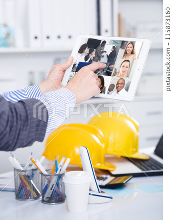 Video conference on smartphone or tablet, business meeting. Communication with business colleagues via video conference closeup Video conference on smartphone or tablet, business meeting. Communication with business colleagues via video conference closeup 115873160