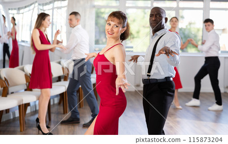 Adult man and adult woman dance twist 115873204