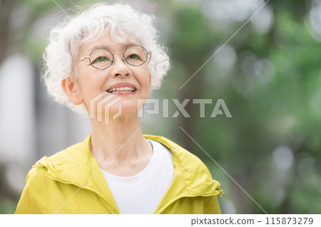Upper body close-up of a gray-haired senior woman running in the park or outdoors Active seniors 115873279