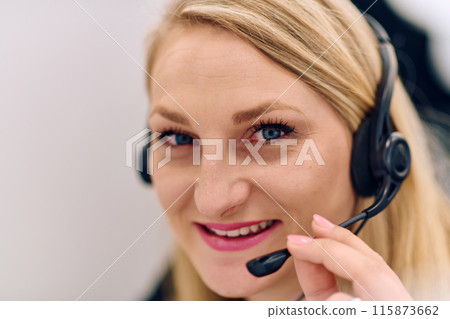 Friendly Call Center Agent Answering Incoming Calls with Headset Providing Remote Customer Service. 115873662