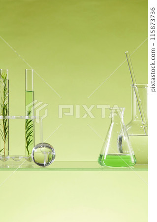 Concept of chemical, scientific experiment with some laboratory glassware containing liquid and tea tree leaves. A glass ball decorated. Liquid purification in the laboratory Concept of chemical, scientific experiment with some laboratory glassware containing liquid and tea tree leaves. A glass ball decorated. Liquid purification in the laboratory 115873736