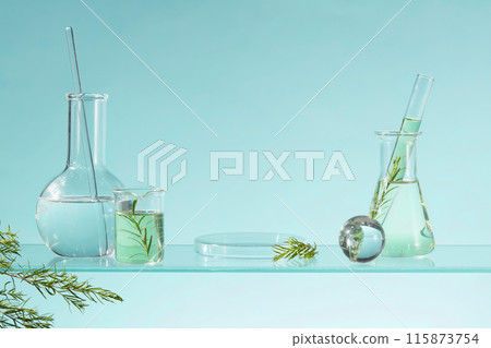 A glass podium in round shaped arranged with various types of laboratory glassware filled with liquid. Minimal podium display for cosmetic product presentation A glass podium in round shaped arranged with various types of laboratory glassware filled with liquid. Minimal podium display for cosmetic product presentation 115873754
