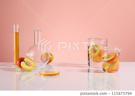 The photo of laboratory theme with peach ingredient, white table countertop displaying glassware of experiment. Vacant space for showing product and adding design elements, frontal shot 115873794