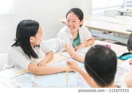 Children studying with friends at school (active learning, group work, after-school care) 115875353