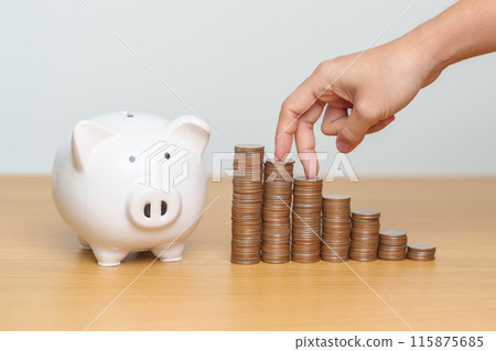 Money Saving for Future Plan, Retirement fund, Pension, Investment, Wealth, Salary and Financial concepts. hand step up coin with piggy bank on table, Money Counting and stack arrangement for Growth 115875685