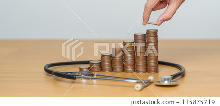 Money Saving, Health Insurance, Medical, Donation and Financial concepts. coins stack with stethoscope, Money stack Counting arrangement for deposit and Healthcare cost Money Saving, Health Insurance, Medical, Donation and Financial concepts. coins stack with stethoscope, Money stack Counting arrangement for deposit and Healthcare cost 115875719