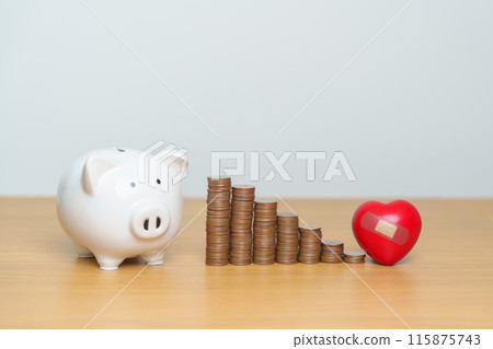 Money Saving, Health Insurance, Medical, Donation and Financial concepts. coins stack and piggy bank with red Heart shape, Money stack Counting arrangement for deposit and Healthcare cost 115875743