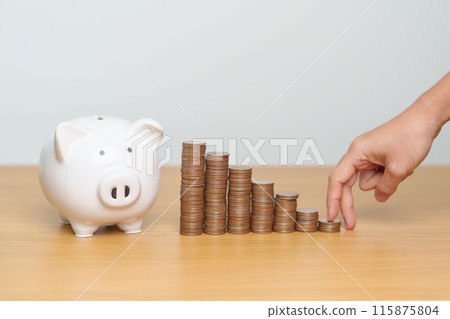 Money Saving for Future Plan, Retirement fund, Pension, Investment, Wealth, Salary and Financial concepts. hand step up coin with piggy bank on table, Money Counting and stack arrangement for Growth Money Saving for Future Plan, Retirement fund, Pension, Investment, Wealth, Salary and Financial concepts. hand step up coin with piggy bank on table, Money Counting and stack arrangement for Growth 115875804