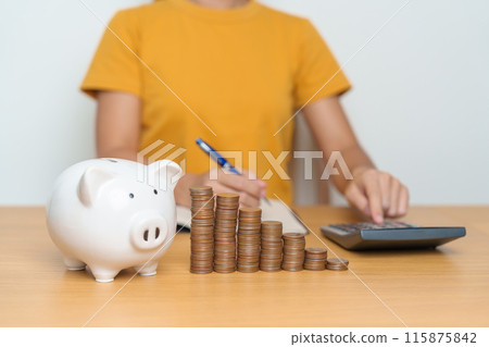 Money Saving for Future Plan, Retirement fund, Pension, Investment, Wealth Business and Financial concepts. Woman Counting and calculate money with coins stack with piggy bank for deposit Money Saving for Future Plan, Retirement fund, Pension, Investment, Wealth Business and Financial concepts. Woman Counting and calculate money with coins stack with piggy bank for deposit 115875842