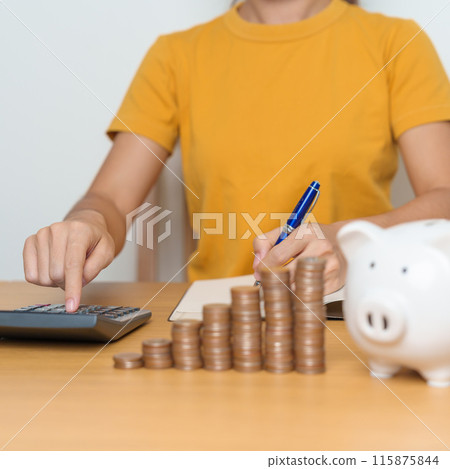 Money Saving for Future Plan, Retirement fund, Pension, Investment, Wealth Business and Financial concepts. Woman Counting and calculate money with coins stack with piggy bank for deposit Money Saving for Future Plan, Retirement fund, Pension, Investment, Wealth Business and Financial concepts. Woman Counting and calculate money with coins stack with piggy bank for deposit 115875844