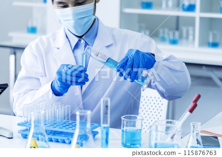 Scientist man holding sample blood test tube in science laboratory. Doctor clinic healthcare technician lab testing blood sample diagnosis. Asian man scientist working in hiv testing medical lab. 115876763