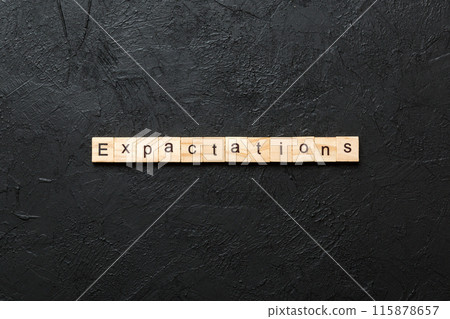 expectation word written on wood block. expectation text on table, concept expectation word written on wood block. expectation text on table, concept 115878657