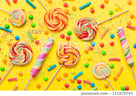 Tasty appetizing Party Accessories Happy Birthday Sweet. Different types of candies on colored background, copy space. Colorful birthday party background Tasty appetizing Party Accessories Happy Birthday Sweet. Different types of candies on colored background, copy space. Colorful birthday party background 115878743