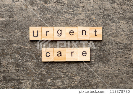 Urgent care word written on wood block. Urgent care text on cement table for your desing, concept 115878780