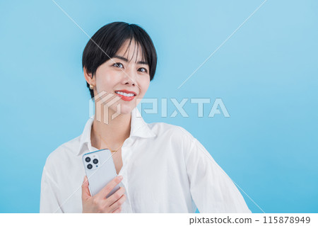 A woman operating a smartphone. 115878949