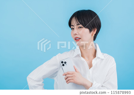 A woman operating a smartphone. A woman operating a smartphone. 115878993