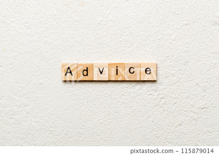 Advice word written on wood block. Advice text on table, concept 115879014