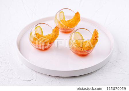 Colorful gourmet shrimp appetizers on white plate Colorful gourmet shrimp appetizers on white plate 115879059