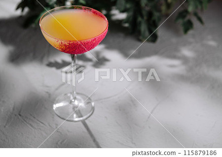 Elegant cocktail with sugar rim on modern surface 115879186