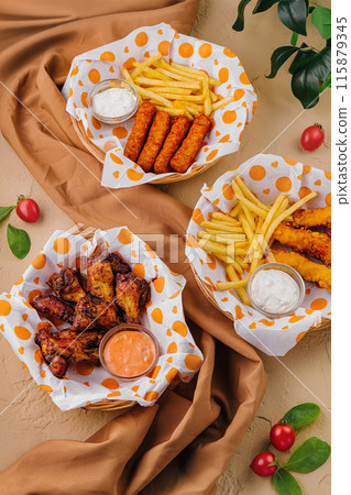 Assorted fast food feast on rustic background 115879345