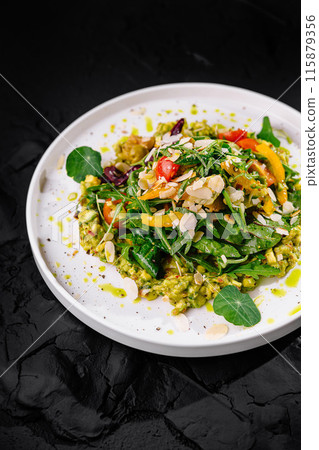 Gourmet vegetarian salad on dark background Gourmet vegetarian salad on dark background 115879356