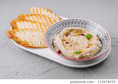 Classic hummus with toasted bread 115879419