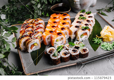 Assorted sushi set on elegant plate with soy sauce Assorted sushi set on elegant plate with soy sauce 115879423