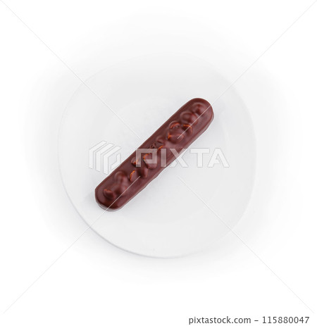 Elegant chocolate Eclair on white plate Elegant chocolate Eclair on white plate 115880047