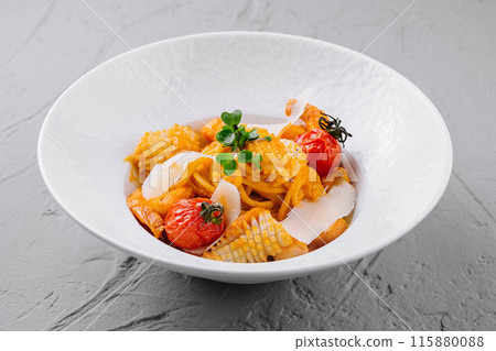 Gourmet pasta dish with roasted tomatoes and herbs Gourmet pasta dish with roasted tomatoes and herbs 115880088