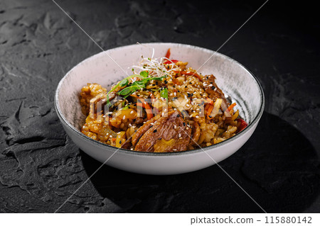 Exotic asian stir-fry dish with sesame seeds Exotic asian stir-fry dish with sesame seeds 115880142