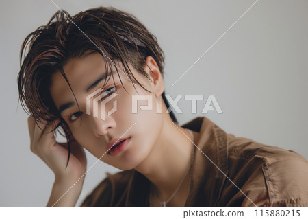 Handsome guy with shaved head and slicked back hair 115880215