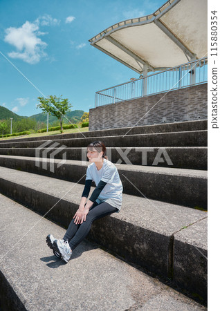 Woman exercising in the park, sportswear, health 115880354