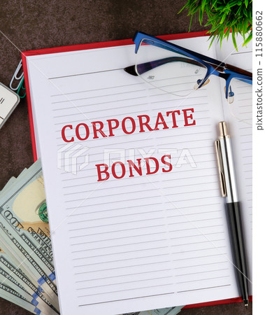 Business concept. The inscription CORPORATE BONDS in a red business notebook in a composition with money and glasses Business concept. The inscription CORPORATE BONDS in a red business notebook in a composition with money and glasses 115880662