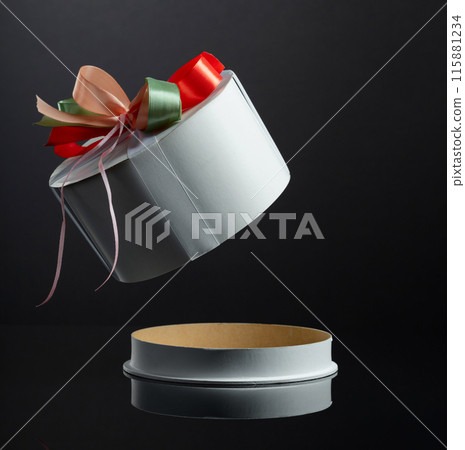 Opened empty gift box on a black reflective background. Opened empty gift box on a black reflective background. 115881234
