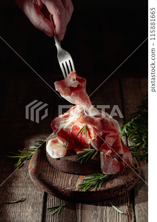 Italian prosciutto or Spanish jamon with rosemary. 115881665