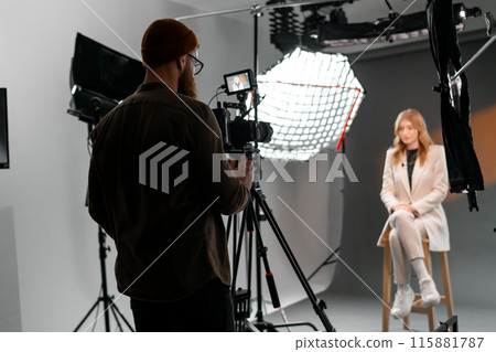 A woman at film studio set. Behind the scenes concept A woman at film studio set. Behind the scenes concept 115881787